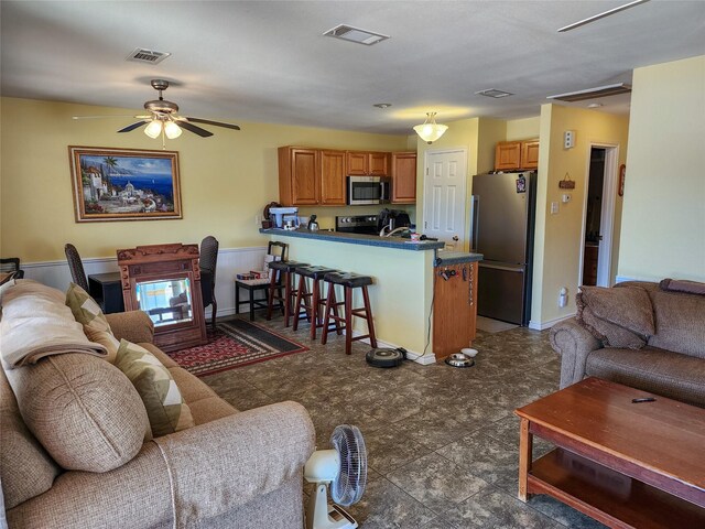 kitchen with appliances with stainless steel finishes, a textured ceiling, and sink