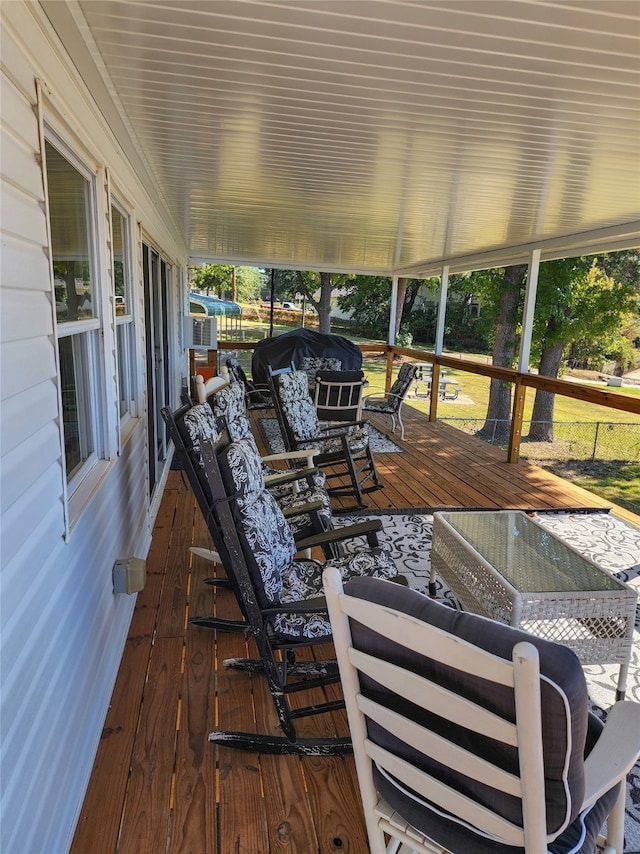 wooden deck featuring an outdoor living space