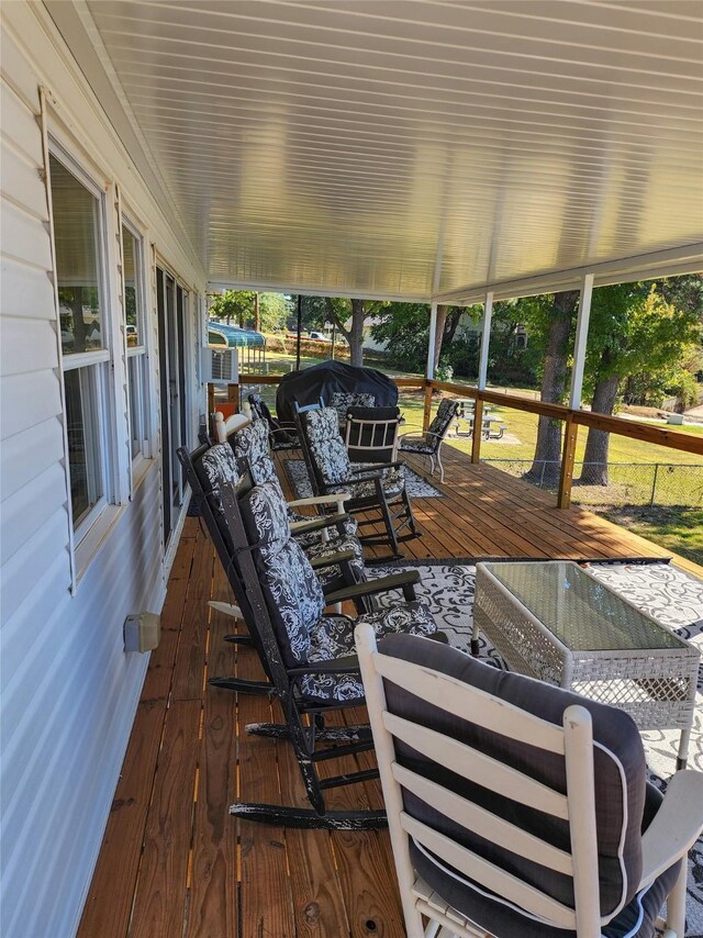 dock area featuring a water view and a lawn