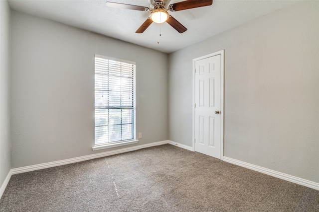 unfurnished room with carpet flooring and ceiling fan