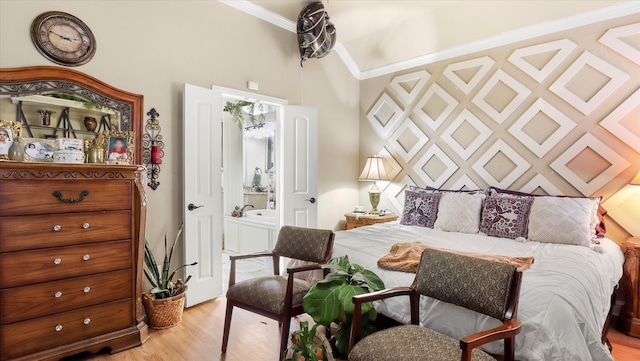 bedroom with ornamental molding and light wood-type flooring