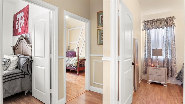 corridor featuring light hardwood / wood-style flooring