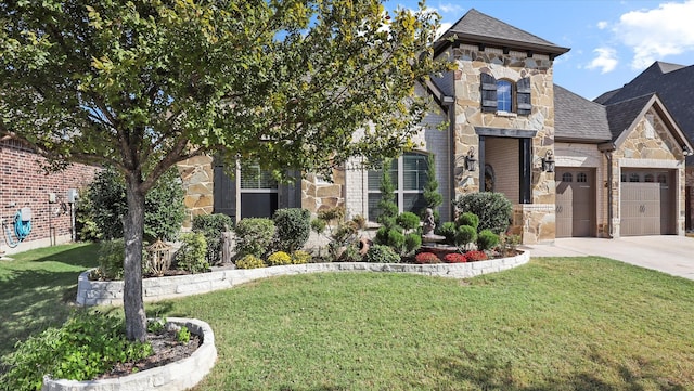 view of front of house featuring a front yard and a garage