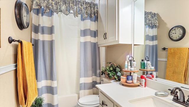 full bathroom featuring vanity, toilet, and shower / tub combo with curtain