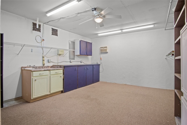 kitchen featuring light carpet and ceiling fan