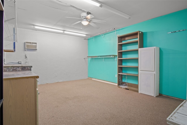 interior space featuring ceiling fan, carpet flooring, and a wall unit AC