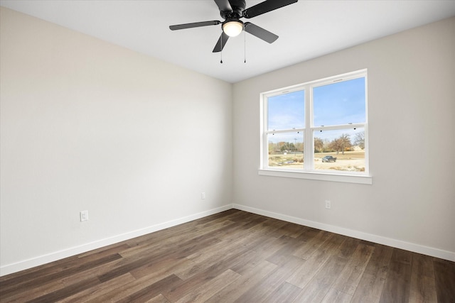 unfurnished room featuring ceiling fan and dark hardwood / wood-style floors