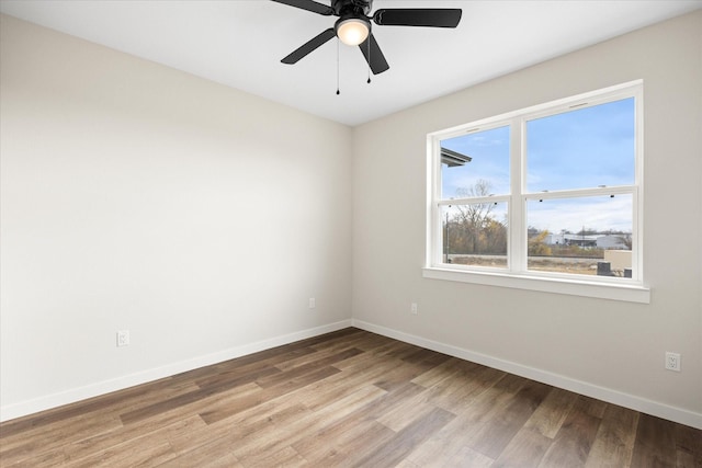 unfurnished room featuring ceiling fan and light wood-type flooring