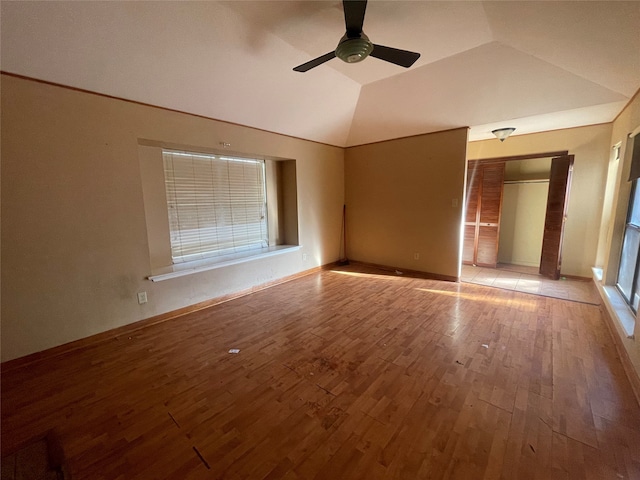 interior space with light hardwood / wood-style flooring, vaulted ceiling, and ceiling fan