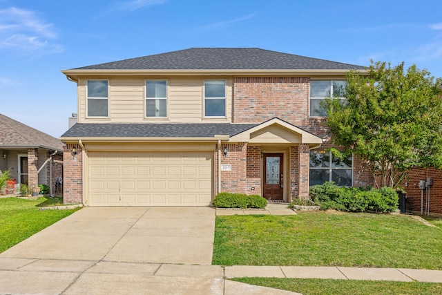 view of front property with a garage and a front yard