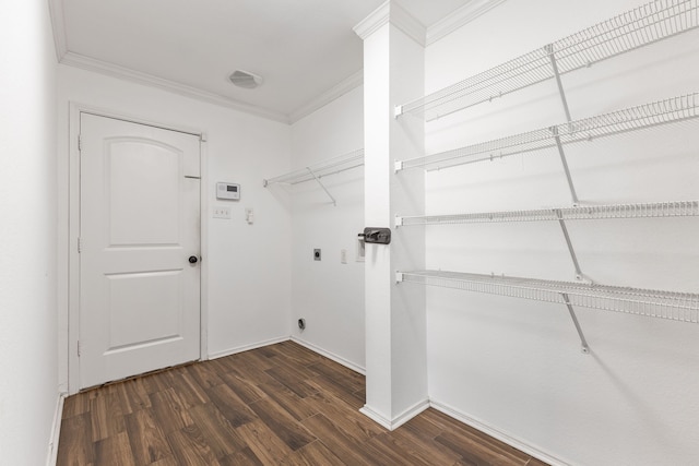 clothes washing area featuring dark hardwood / wood-style flooring, crown molding, and electric dryer hookup