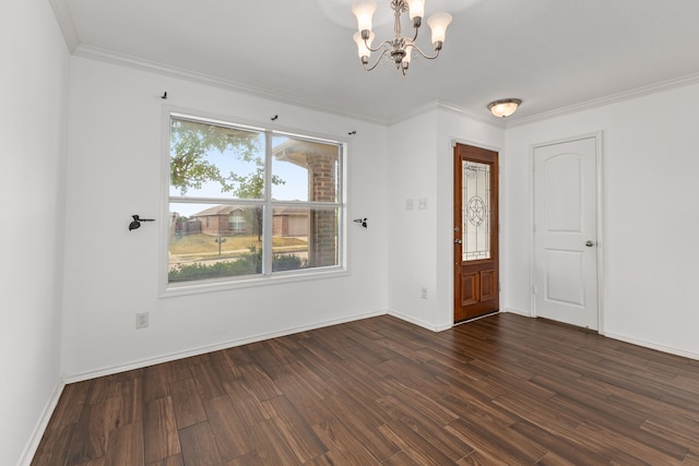 entrance foyer featuring a notable chandelier, dark hardwood / wood-style flooring, and crown molding