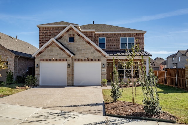 view of front of property featuring a garage and a front yard