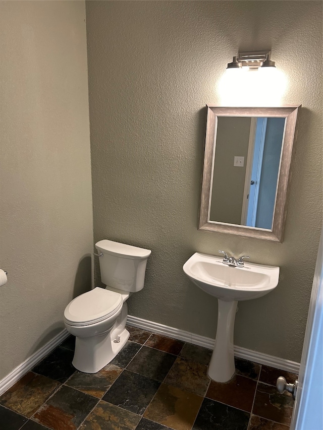 bathroom featuring toilet