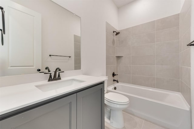 full bath with tile patterned flooring, shower / tub combination, vanity, and toilet