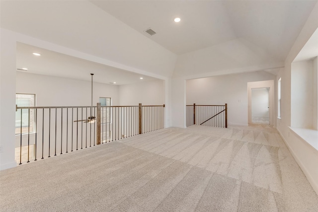 carpeted empty room featuring recessed lighting, visible vents, and baseboards