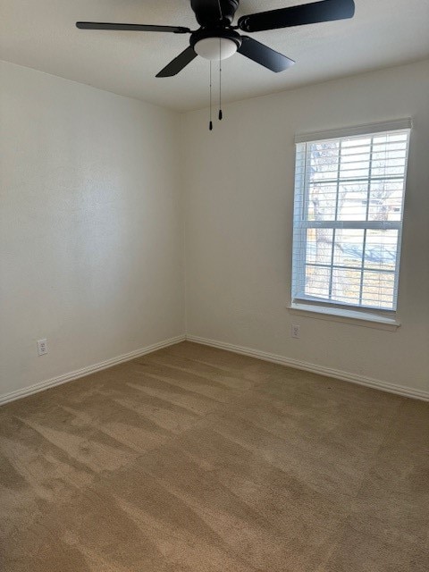 unfurnished room featuring carpet flooring and ceiling fan