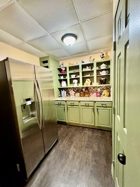 kitchen with dark wood-type flooring, a paneled ceiling, and stainless steel refrigerator with ice dispenser