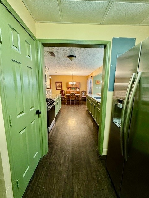 hallway with sink and dark wood-type flooring