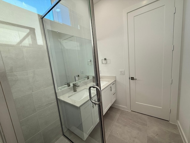 bathroom featuring vanity and a shower with door