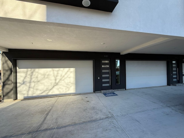 doorway to property with a garage