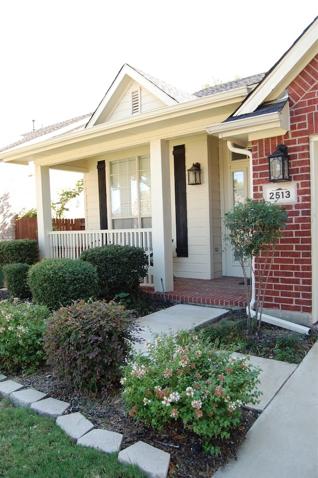 property entrance featuring covered porch