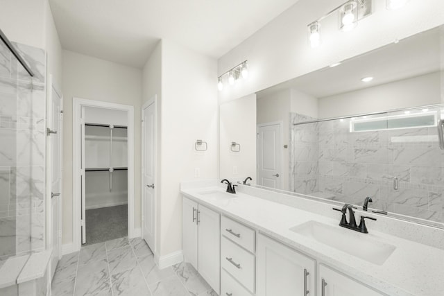 3909 Birch Grove Bnd, Denton, TX 76226 - bathroom featuring a stall shower, marble look tile flooring, a walk in closet, baseboards, and double vanity
