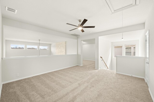 empty room featuring vaulted ceiling and carpet floors