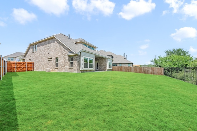 3909 Birch Grove Bnd, Denton, TX 76226 - rear view of property featuring brick siding and a shingled roof