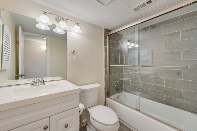 full bathroom with toilet, shower / bath combination with glass door, a textured ceiling, and vanity