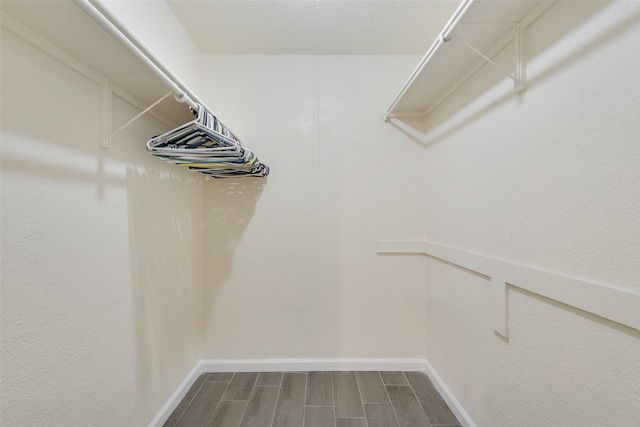 spacious closet featuring hardwood / wood-style floors