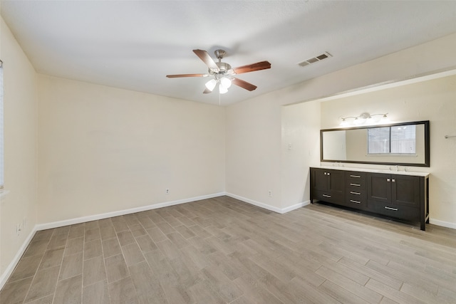 unfurnished bedroom featuring ceiling fan and light hardwood / wood-style flooring