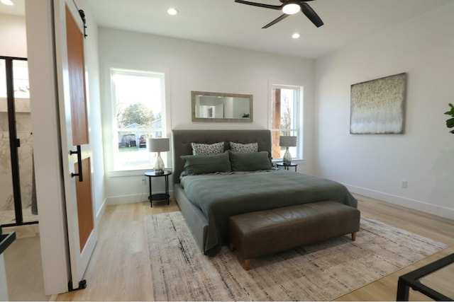 bedroom featuring ceiling fan and light hardwood / wood-style floors