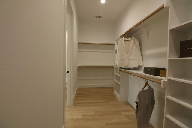 spacious closet featuring light wood-type flooring