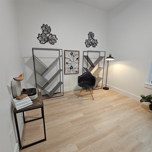 sitting room featuring light hardwood / wood-style flooring