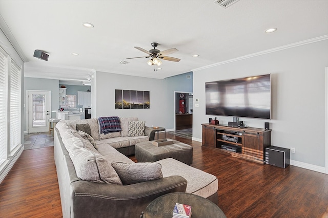 living room featuring ornamental molding, dark hardwood / wood-style floors, and ceiling fan