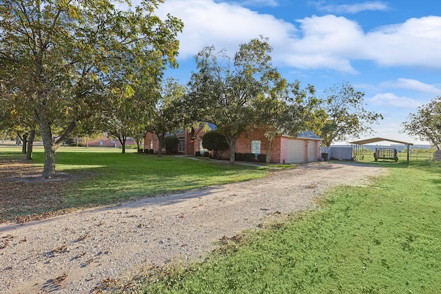 obstructed view of property featuring a front yard and a garage