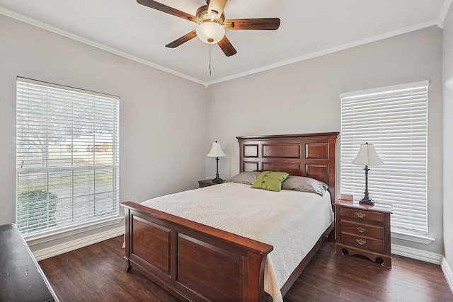 bedroom with dark hardwood / wood-style flooring, crown molding, and ceiling fan