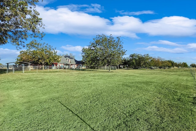 view of yard with a rural view