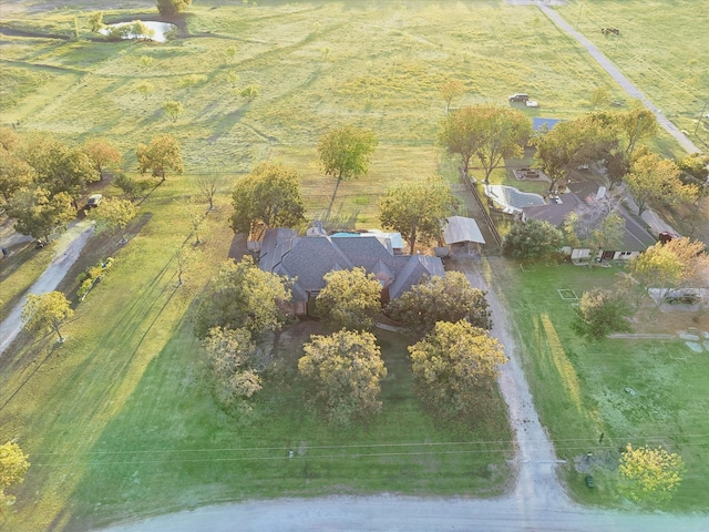 birds eye view of property with a rural view and a water view