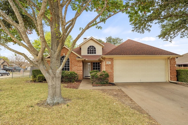 view of front facade with a front yard and a garage