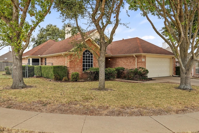 single story home featuring brick siding, fence, driveway, a chimney, and a front yard