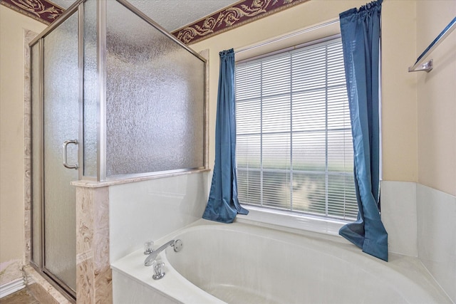 bathroom with separate shower and tub