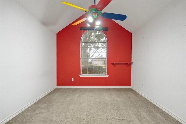 empty room with carpet floors, ceiling fan, and lofted ceiling