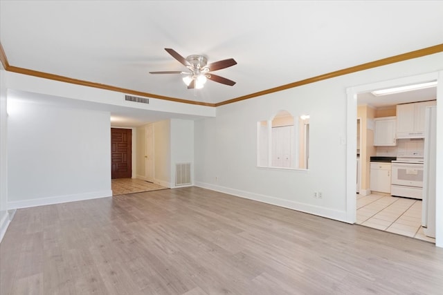 unfurnished living room featuring ornamental molding, light hardwood / wood-style floors, and ceiling fan