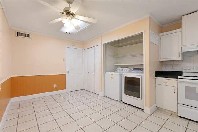 laundry area with ornamental molding, washer and dryer, light tile patterned floors, and ceiling fan