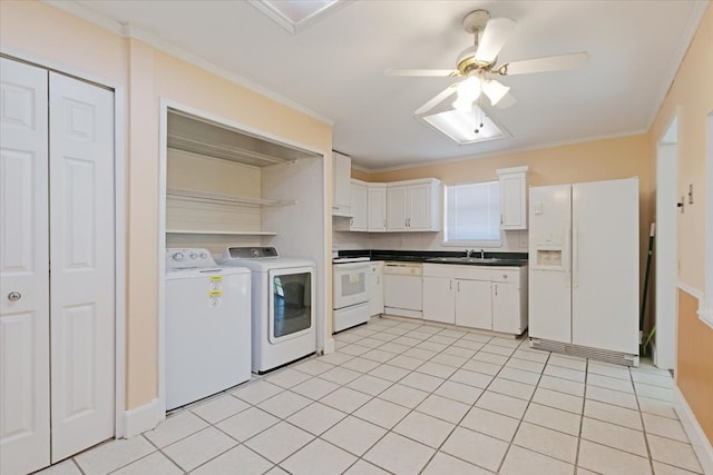 kitchen featuring white appliances, separate washer and dryer, white cabinetry, ceiling fan, and light tile patterned floors