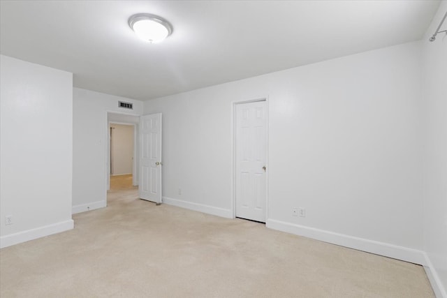 empty room with light colored carpet