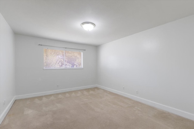 spare room with light carpet