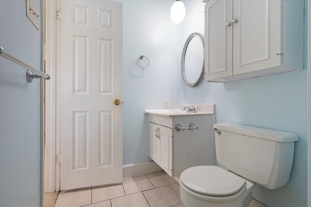 bathroom featuring vanity, toilet, and tile patterned floors